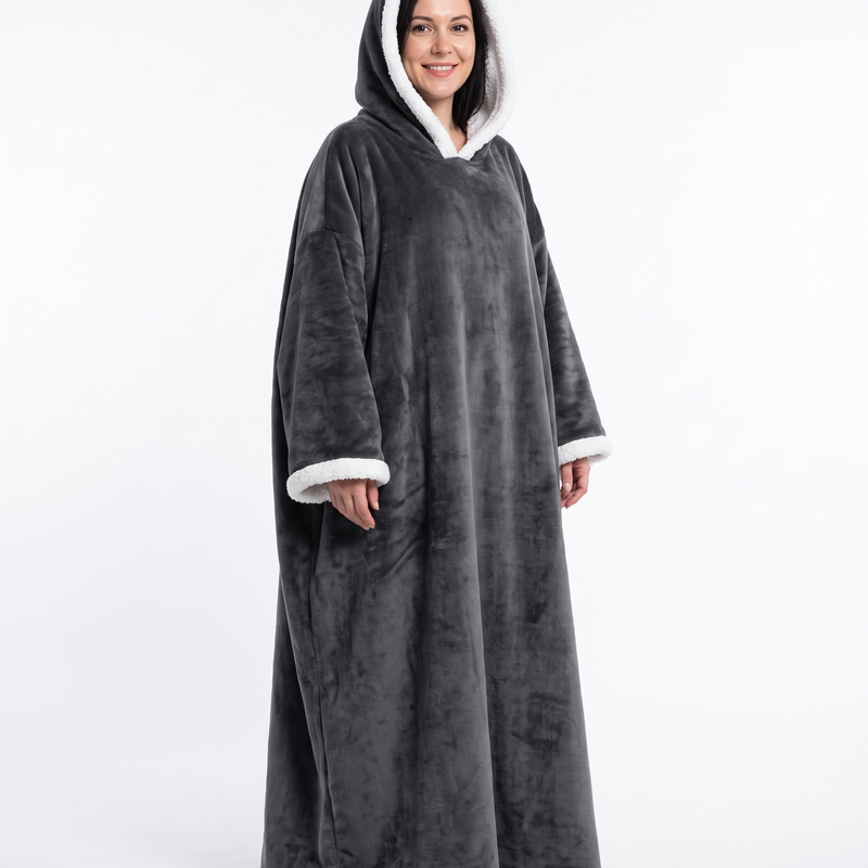 Woman wearing the grey wearable sherpa electric blanket with the hood up